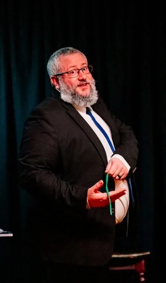 Rich interacting with guests during close-up magic