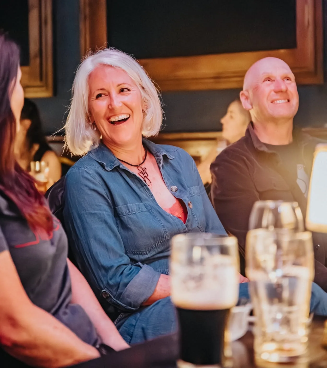 Children and adults laughing together during the show